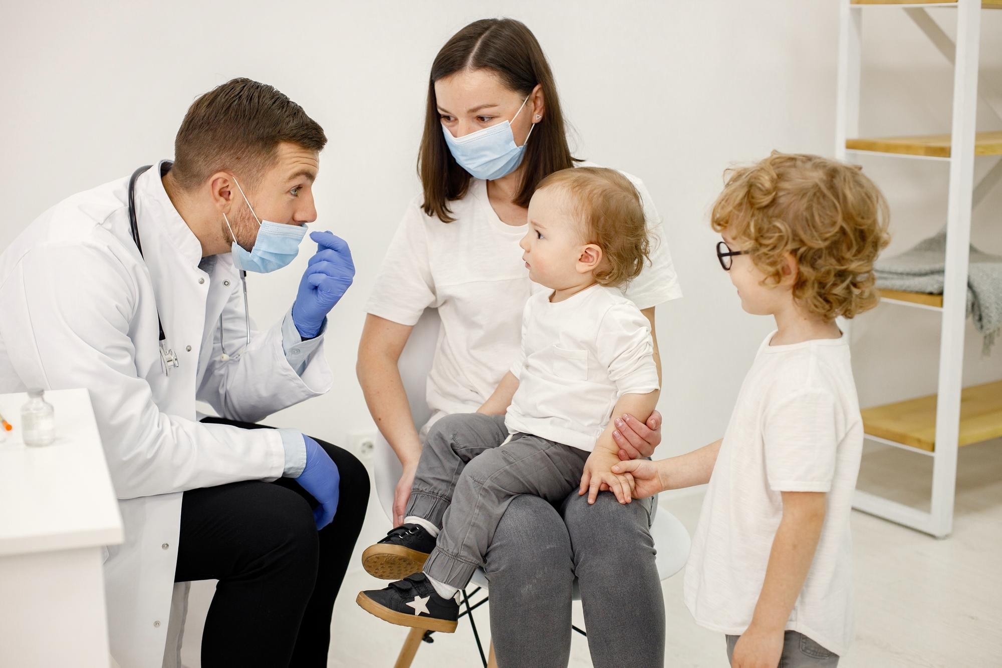 A doctor with a mother and daughter
